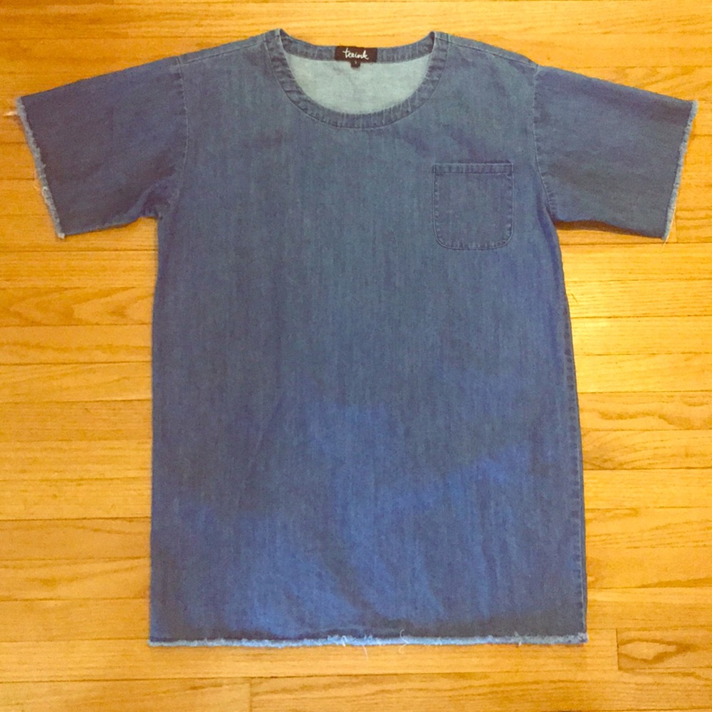 Denim dress with frayed details and front pocket.
